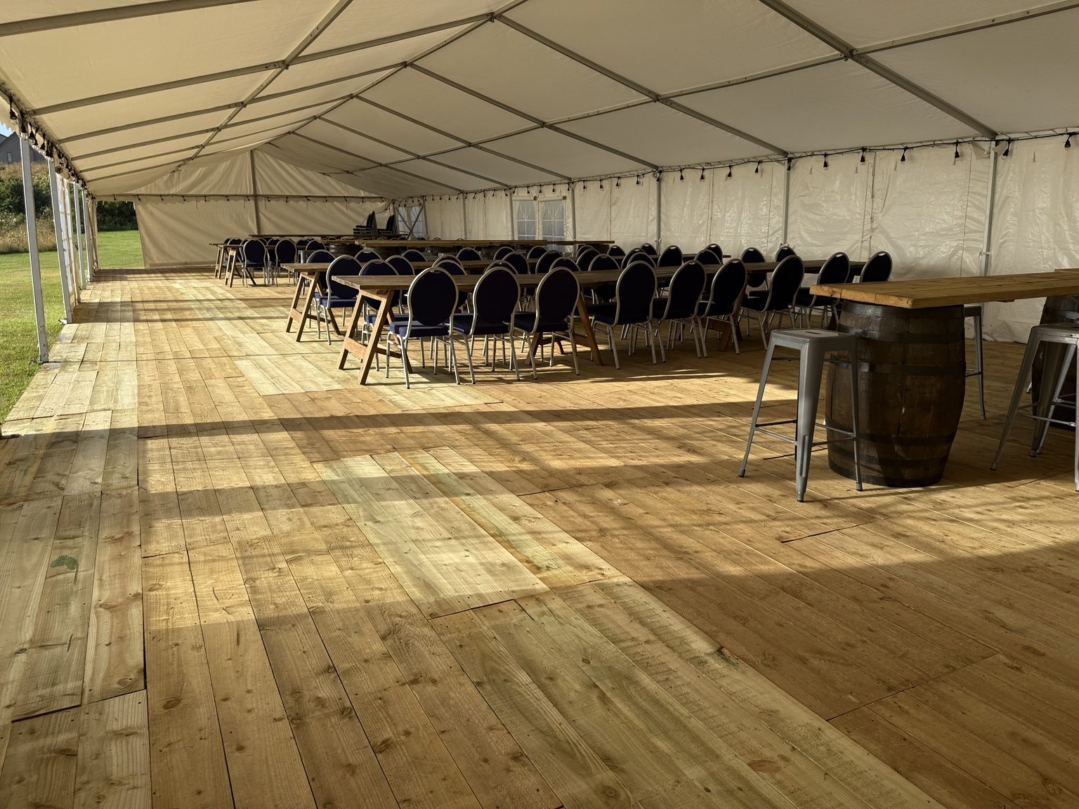 Marquee interior with flooring and seating